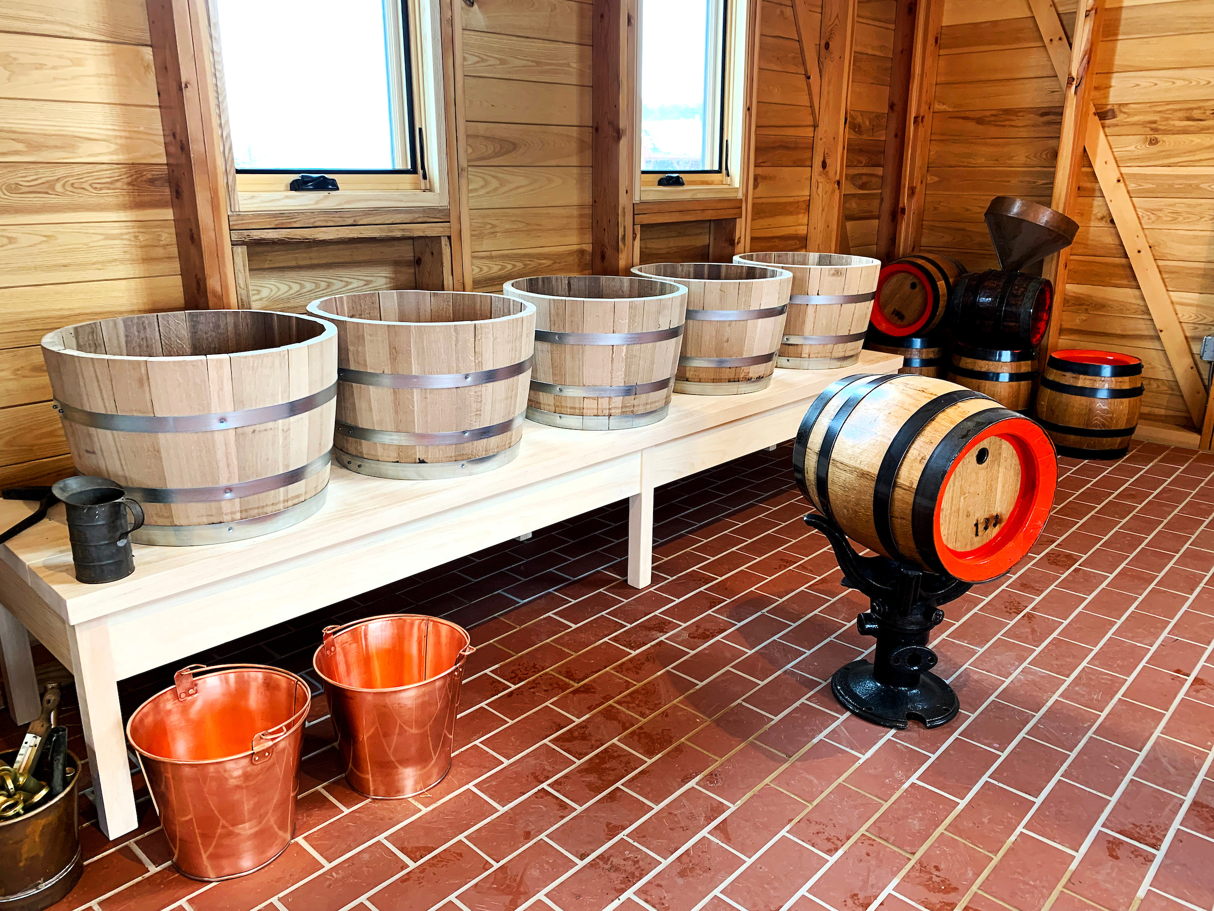 The five fermentation vats (one for each day of brewing during the summer season) and kegs shown as equipment is moved into the new Brewhouse at Old World Wisconsin in preparation for the June 2022 grand opening events. Taken 2.24.22 by Dan Freas