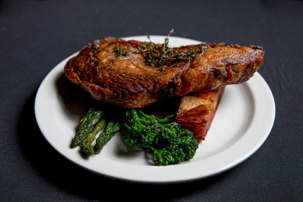 butter braised ribeye with potato pave and broccolini